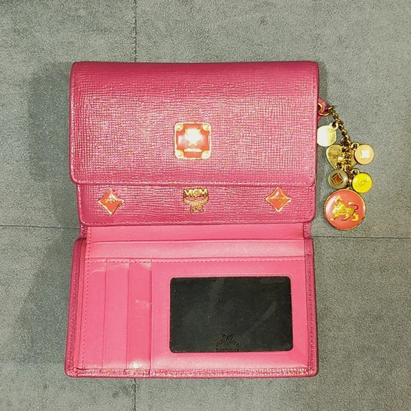 EUC MCM SAFFIANO LEATHER COMPACT WALLET DECORATIVE METAL MCM BAGDES & CHARMS